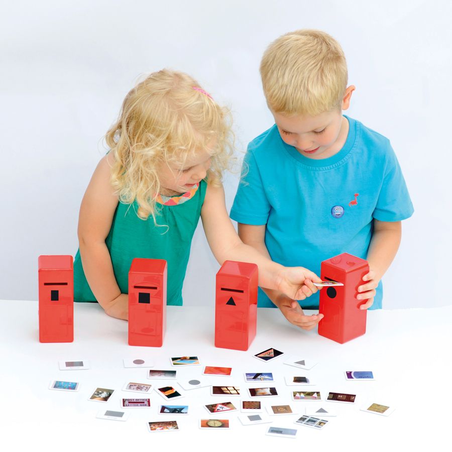 Shape Posting Game, The Shape Posting Game features 4 brightly coloured ‘post-boxes’ and 40 individual double-sided picture cards, with real life photos on! Each photo contains one dominant shape, and children are encouraged to sort the photos into their corresponding boxes. This is improving their shape recognition and sorting skills. Once the pictures are sorted, you can create simple counting games and activities for them by grouping the different shapes together! The shape posting game is a fantastic re